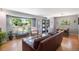 Bright living room with hardwood floors and large window offering ample natural light at 6868 S Birch Way, Centennial, CO 80122