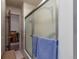 Bathroom with frosted glass shower doors and neutral tile at 2015 Arapahoe St, Golden, CO 80401