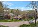 Street view of a well-maintained neighborhood with mature trees, landscaping, and mountain views at 2015 Arapahoe St, Golden, CO 80401