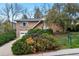 Charming brick home with an attached garage, mature landscaping, and a well-maintained front yard at 2015 Arapahoe St, Golden, CO 80401