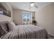 Bright bedroom with a window and ceiling fan at 6005 Turnstone Pl, Castle Rock, CO 80104