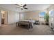 Primary bedroom with ceiling fan and large windows at 6005 Turnstone Pl, Castle Rock, CO 80104