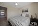 Well-lit bedroom with striped bedding and a ceiling fan at 6005 Turnstone Pl, Castle Rock, CO 80104