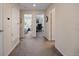 Bright hallway with doors to bedrooms and office at 6005 Turnstone Pl, Castle Rock, CO 80104