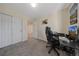 Home office with a desk, chair, and double door closet at 6005 Turnstone Pl, Castle Rock, CO 80104