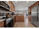 Bright kitchen featuring an island and stainless steel appliances at 6005 Turnstone Pl, Castle Rock, CO 80104