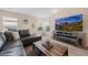 Spacious living room with sectional sofa, large TV, and electric fireplace at 6005 Turnstone Pl, Castle Rock, CO 80104