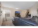 Living room featuring a sectional sofa, TV, and stairs to the second floor at 6005 Turnstone Pl, Castle Rock, CO 80104