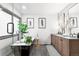 Modern bathroom with black soaking tub, plant decor, double sink vanity and glass enclosed shower at 600 Cascade Dr, Golden, CO 80403