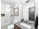 Bright bathroom featuring glass enclosed shower, large vanity mirror and neutral wall decor at 600 Cascade Dr, Golden, CO 80403