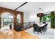 This dining room features a brick archway, hardwood floors, and views of the surrounding landscape at 600 Cascade Dr, Golden, CO 80403