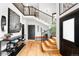 Bright entryway with hardwood floors, statement art, modern lighting, and staircase to upper level at 600 Cascade Dr, Golden, CO 80403