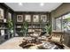 Comfortable living room with decorative shelving, unique decor, leather chairs and an area rug at 600 Cascade Dr, Golden, CO 80403