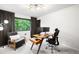 Bright home office featuring modern desk, comfortable chair, and natural light from the window view at 600 Cascade Dr, Golden, CO 80403