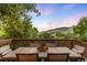Outdoor dining area with mountain view, featuring a table and chairs, perfect for entertaining at 600 Cascade Dr, Golden, CO 80403