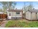 Quaint backyard with a small patio area and storage shed at 2731 S Logan St, Englewood, CO 80113