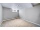 Finished basement room with neutral carpet and basement window at 2731 S Logan St, Englewood, CO 80113