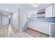 Finished basement features tile flooring, laundry area, and plentiful cabinet and storage space at 2731 S Logan St, Englewood, CO 80113
