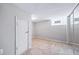 Bedroom with neutral carpet, a closet with mirrored doors, and a basement window at 2731 S Logan St, Englewood, CO 80113