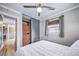 Bedroom with ceiling fan, window with blinds, closet with built-ins, with hardwood floors at 2731 S Logan St, Englewood, CO 80113