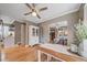 Open dining area featuring refinished hardwood floors and easy access to the adjacent kitchen and living room at 2731 S Logan St, Englewood, CO 80113