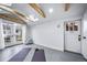 Bright flex space features a skylight and French doors to the backyard at 2731 S Logan St, Englewood, CO 80113