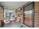 Charming front porch with bistro set, brick accents, and a welcoming entrance at 2731 S Logan St, Englewood, CO 80113