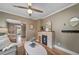 Living room that flows into the dining and kitchen area, featuring hardwood floors and a neutral color palette at 2731 S Logan St, Englewood, CO 80113