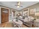 Bright living room featuring a comfortable couch, hardwood floors, and stylish decor at 2731 S Logan St, Englewood, CO 80113