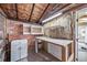 Workshop in need of renovations features a brick wall and a work bench at 2731 S Logan St, Englewood, CO 80113