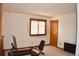 Bright bedroom featuring a window with blinds and space for exercise equipment at 9946 Wyecliff Dr, Highlands Ranch, CO 80126