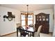 Cozy dining room with natural light, a chandelier, and classic furniture at 9946 Wyecliff Dr, Highlands Ranch, CO 80126