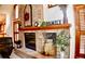 Close-up of the fireplace and mantle with decorations in the Gathering room at 9946 Wyecliff Dr, Highlands Ranch, CO 80126