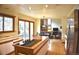 Modern kitchen with stainless steel appliances, an island, and sliding glass doors at 9946 Wyecliff Dr, Highlands Ranch, CO 80126