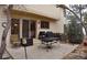 Outdoor patio with a grill, seating area, and sliding glass door entrance at 9946 Wyecliff Dr, Highlands Ranch, CO 80126