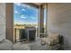 Cozy balcony with outdoor seating and a grill overlooking the neighborhood at 1575 W 68Th Ave, Denver, CO 80221