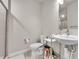 Cozy bathroom featuring a glass shower, toilet, and a modern vanity with a stylish sink at 1575 W 68Th Ave, Denver, CO 80221