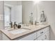 Beautifully appointed bathroom with double sinks and quartz countertops at 1575 W 68Th Ave, Denver, CO 80221