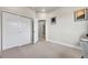 A modern bedroom with large closet doors, and an ensuite bathroom at 1575 W 68Th Ave, Denver, CO 80221