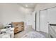 Bright Bedroom featuring modern baby furniture with a playful rug on the floor at 1575 W 68Th Ave, Denver, CO 80221