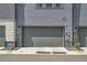 A gray two car garage at 1575 W 68Th Ave, Denver, CO 80221