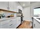 Bright kitchen with white cabinets, stainless steel appliances, and granite countertops at 1575 W 68Th Ave, Denver, CO 80221