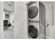 Convenient laundry room featuring a stacked washer and dryer set at 1575 W 68Th Ave, Denver, CO 80221