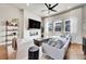 Comfortable living room with fireplace, TV, sofa, and accent chairs at 1575 W 68Th Ave, Denver, CO 80221