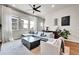 Bright living room with oversized sofa, coffee table, and plenty of natural light at 1575 W 68Th Ave, Denver, CO 80221