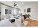 Inviting living area features large windows, hardwood floors, and comfortable seating with a contemporary design at 1575 W 68Th Ave, Denver, CO 80221