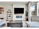 Cozy living room featuring a modern fireplace and flat screen tv on the wall at 1575 W 68Th Ave, Denver, CO 80221