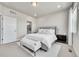 Bedroom with a plush bed, a bench seat and a view from the window at 1575 W 68Th Ave, Denver, CO 80221