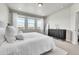 Airy bedroom with a large bed, and neutral design at 1575 W 68Th Ave, Denver, CO 80221