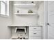 Bright office nook with built-in desk, drawers, and shelving at 1575 W 68Th Ave, Denver, CO 80221